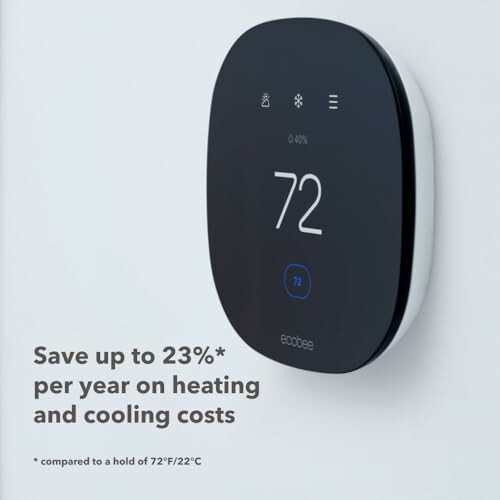 Smart thermostat displaying temperature of 72 degrees, promoting up to 23% savings on heating and cooling costs.